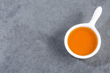 Organic honey in ceramic bowl