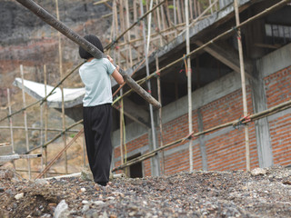 Children working at construction site for world day against children labour concept: