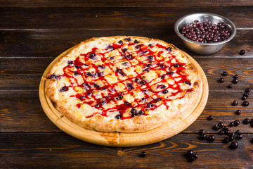 Fruit sweet pizza. Pizza for dessert. .Pizza with sweet berries