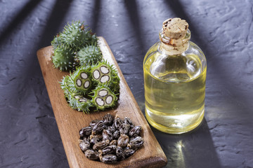 beans and castor oil on the black table