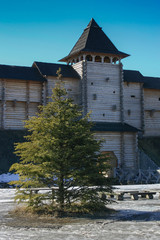 The central tower of an ancient wooden fortress with a gate