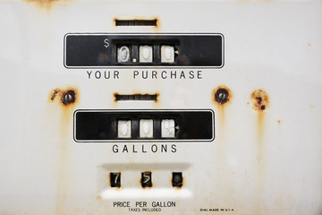 Dials on an old rusting gas pump long abandoned.