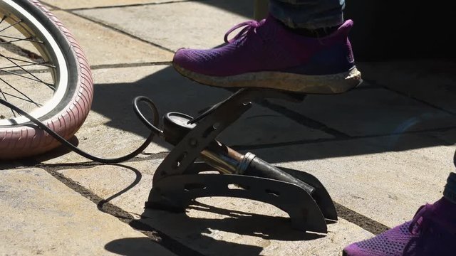 Pumping up bike tire
