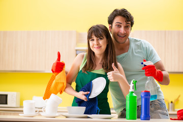 Young couple working at kitchen 