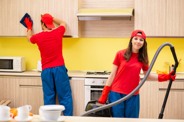 Cleaning professional contractors working at kitchen