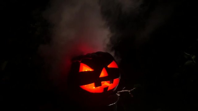 Red eye pumpking in Halloween Horror Scene