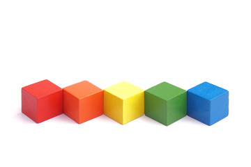 multi colored wooden block on white background