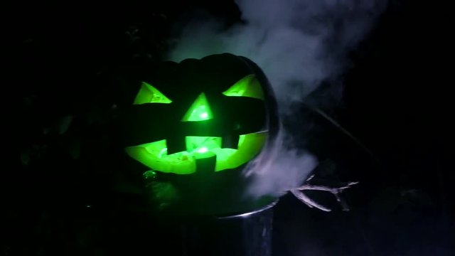 Green eyes pumpking in Halloween Horror Scene