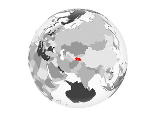 Tajikistan on grey globe isolated