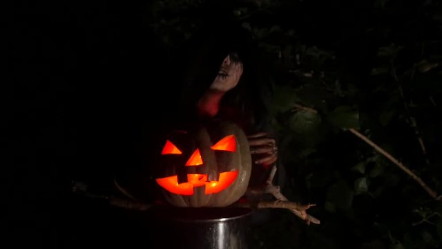Red eye pumpking in Halloween Horror Scene