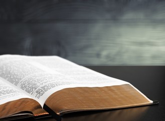 Holy bible book on wooden table