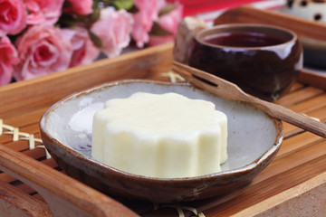 Yellow peach ice cream moon cake on the table