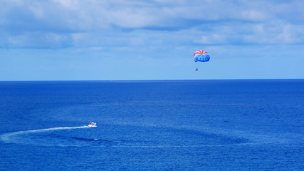 Parasailing also know as parascending or parakiting in the ocean