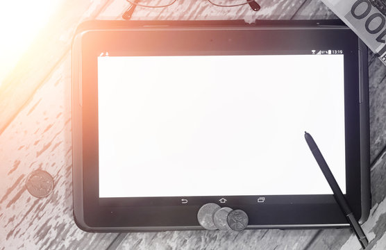 The graph of income growth. Electronic tablet with a graph of gr