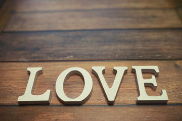 word Love from wooden letters on background