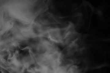 White smoke on a black background. Texture of smoke. Clubs of wh
