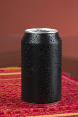 black aluminum can, with drops of water