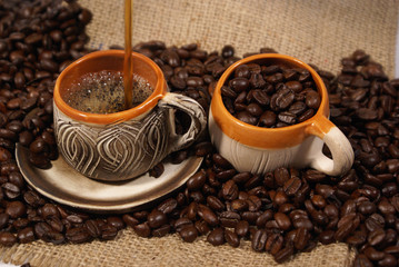 Coffee display in two cups on the table