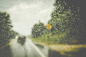 Raindrops On a Windshield, Blurred Road Background