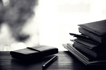 A stack of textbooks on a table