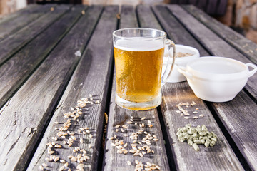 Glass of a tasty home made beer on table