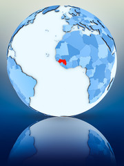 Guinea on blue globe