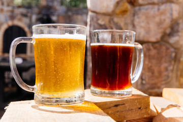Glass of a tasty home made beer on table