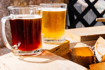 Glass of a tasty home made beer on table