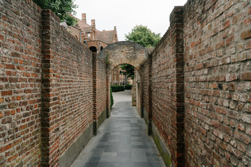 An old stone brick alley in Brugge, Belgium