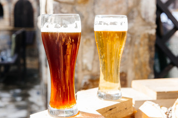 Glass of a tasty home made beer on table