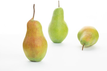 green ripe pear on white background