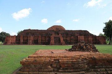 The ruin square base of the main brick stupa of Khao Klang Nok on straight front, influence of...