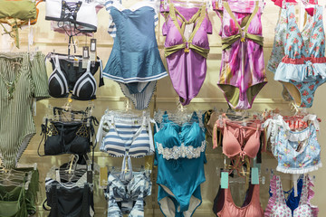 Woman underwear. Lingerie on rack. Retail shop, store. Women swimwear in the store.
