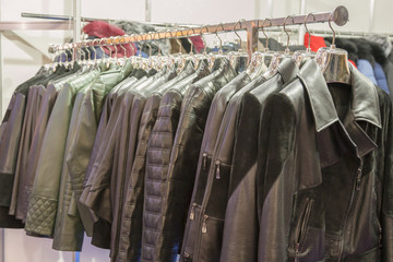 Obraz premium Leather jackets on the hangers at the store. Various leather jackets on the hangers at the store