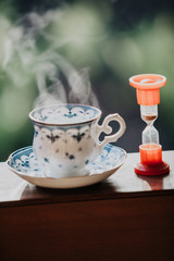 Elegant tea cup and hourglass stand shelf