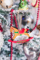 Brown wooden horse on Christmas tree