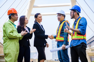 Business teamwork.They are standing and  clap your hand. After Shake hands together.That is good work and corporate. Success ,together, Bangkok,Thailand,Photo concept business and team.