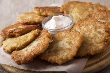 Potato pancakes with sour cream. Draniki