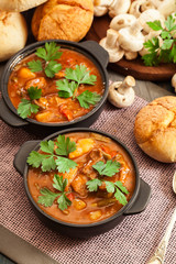 Stew soup with meat, potatoes, mushrooms and red pepper