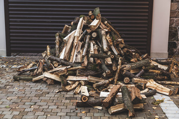 pile of firewood lies in yard