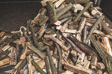 firewood of different shapes piled with bunch