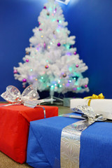 Christmas gifts on the background of a Christmas tree.