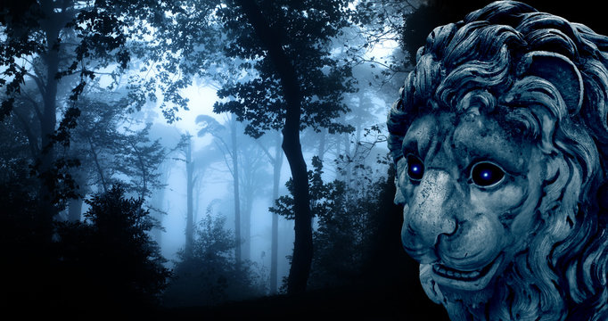 Ancient lion statue in misty forest