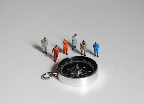 Image seen above compass and miniature people.