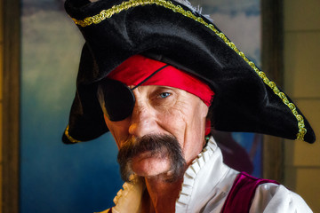 Pirate with an Eye Patch and One Piercing Eye Looks Intesly at the Camera He Has a Tripoint Hat and...