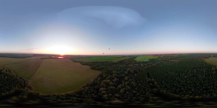 VR360 Hot air balloon in the sky over field in the countryside in the beautiful sky and sunset. Aerial view Aerostat fly in countryside.