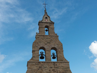 BELL TOWER OF THE CHURCH OF SANTIBAÑEZ DE LA ISLA, LEON, ESPAÑA, EUROPE, JULY 15, 2018