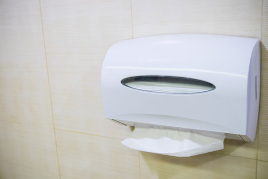 Close up tissue box  on toilet room. Sanitation in public place concept. image for copy space and objects.