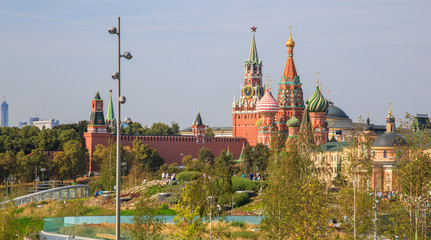 Green trees and grass on the background of the Moscow Kremlin and the red square in the park Zaryadye