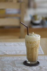 Spinning coffee on a wooden table